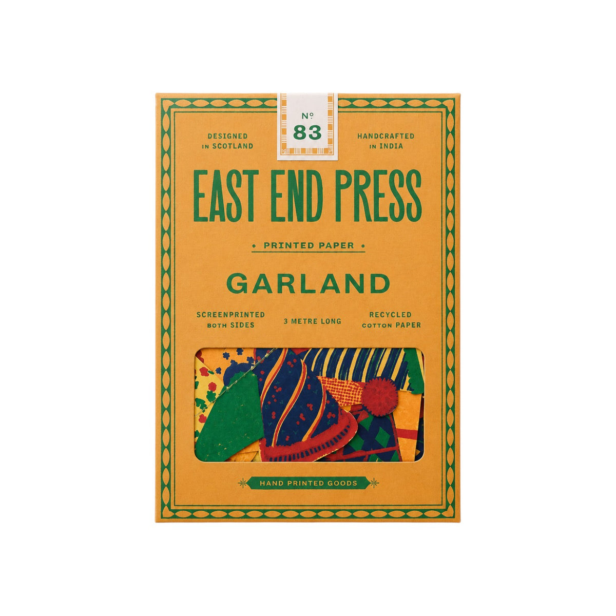 The Tiny Finch East End Press birthday party garland in a yellow box with colourful screen-printed paper shapes.