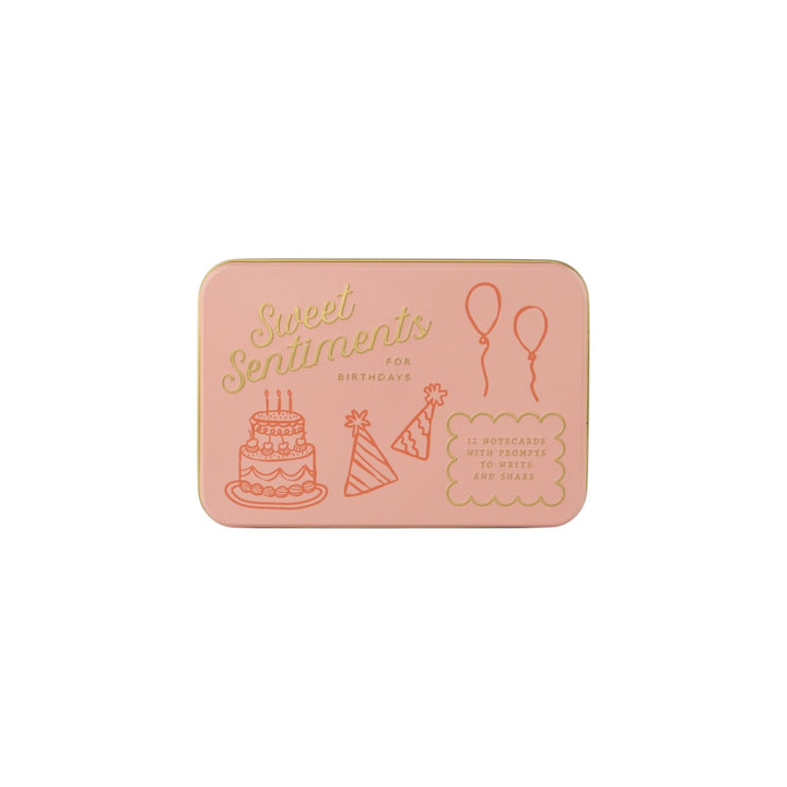 The Tiny Finch pink keepsake tin for Sweet Sentiments birthday notecards with gold-pressed illustrations and text.