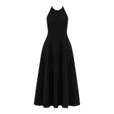 The Tiny Finch black broderie anglaise maxi dress with a halter neckline and A-line skirt.