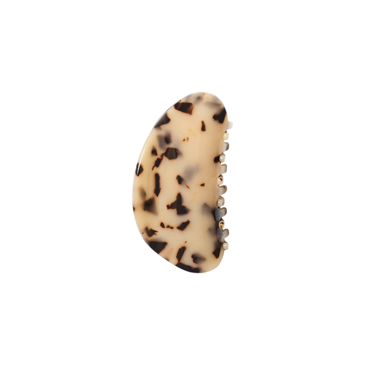 The Tiny Finch crescent hair claw in blonde tortoise shell pattern with a smooth, contoured surface.