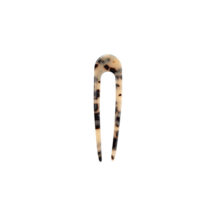The Tiny Finch French hair pin in blonde tortoise Italian acetate, a 5-inch handcrafted U-shaped hair accessory.