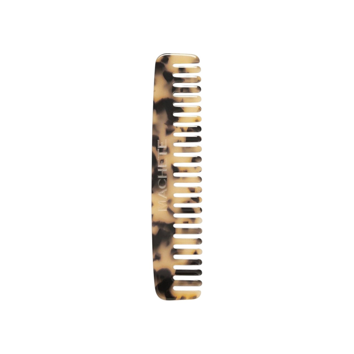 The Tiny Finch blonde tortoise wide-tooth travel comb handcrafted from Italian bio-acetate for all hair types.