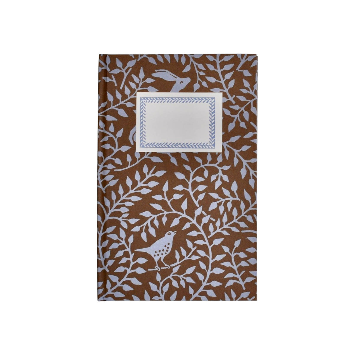 The Tiny Finch hardback notebook in bronze with a dancing hare and bird pattern and a rectangular cream label.