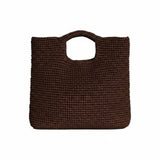 The Tiny Finch brown raffia Marina bag with a square shape and cutout handles, featuring an interior leather base.