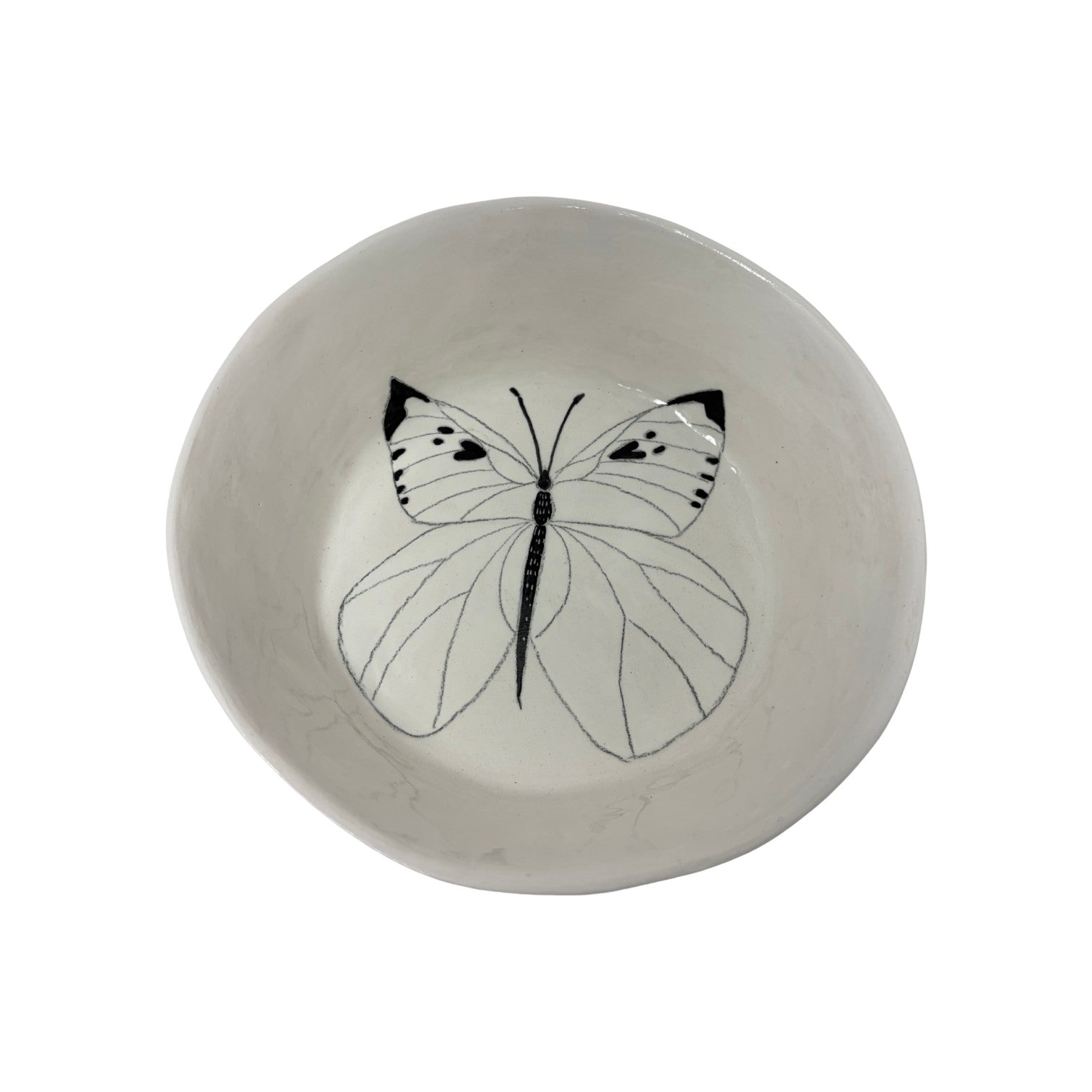 The Tiny Finch large ceramic snack bowl featuring a detailed black and white butterfly illustration on the interior.