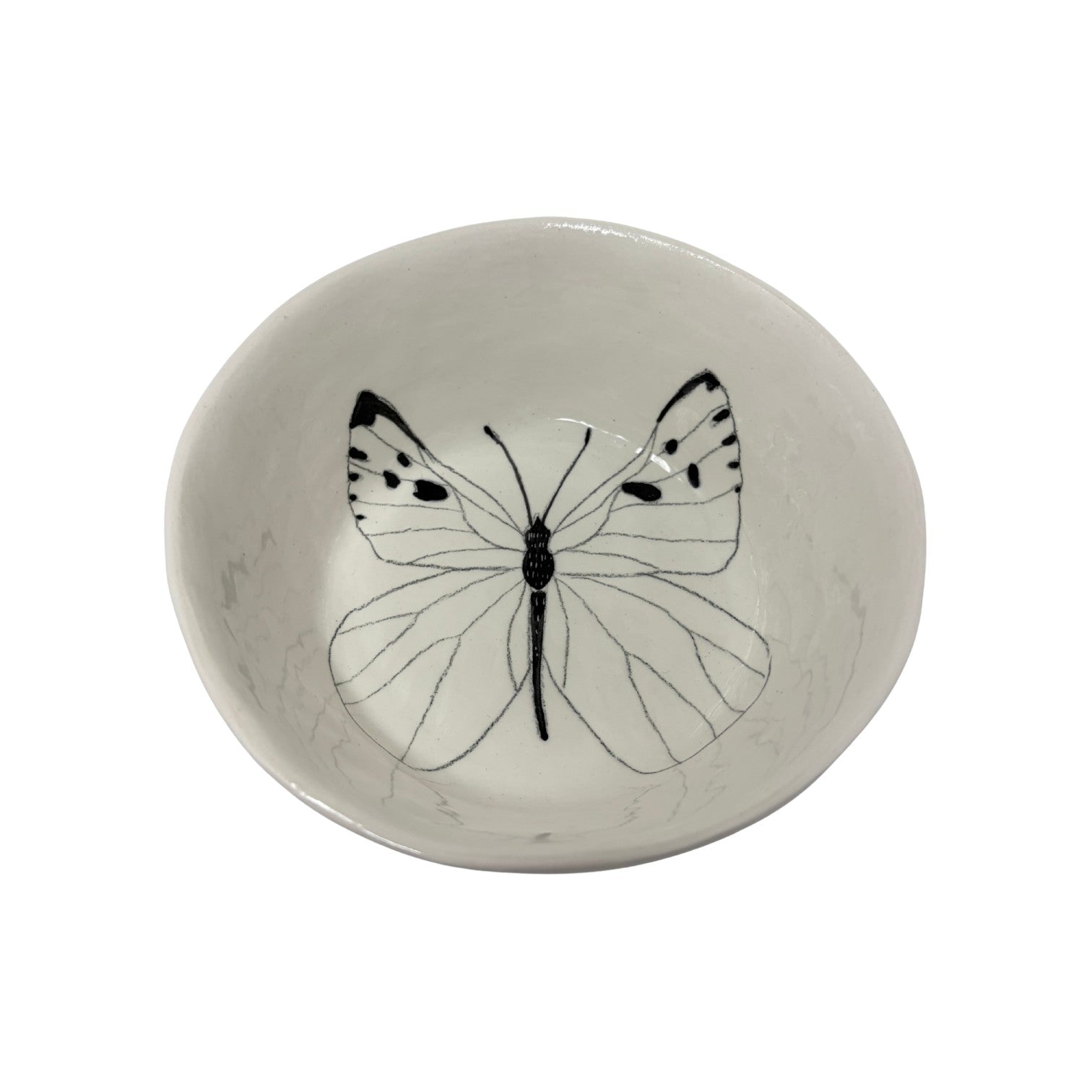 The Tiny Finch snack bowl featuring a delicate black line-art butterfly illustration on a white ceramic surface.