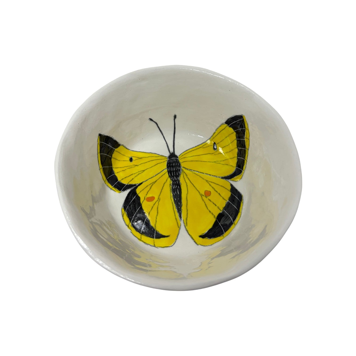 The Tiny Finch ceramic snack bowl featuring a hand-painted yellow and black butterfly design on a white background.