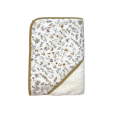 The Tiny Finch Camille baby towel featuring a floral Liberty fabric print with a soft white sponge loop backing.