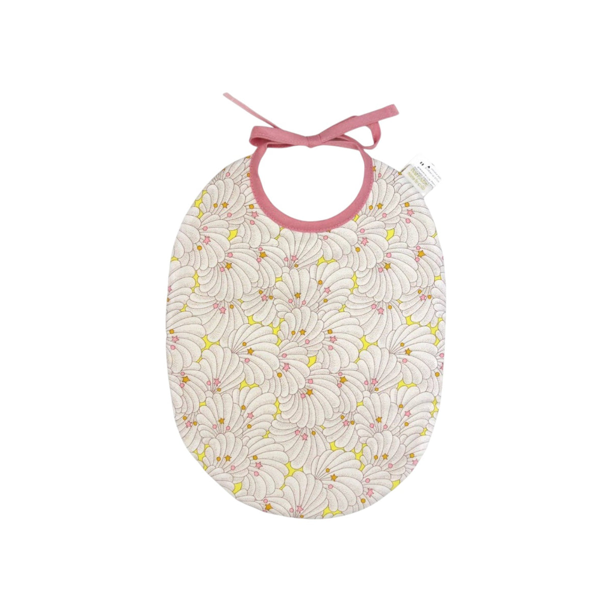 The Tiny Finch Bib Cassandre featuring a delicate Liberty fabric shell pattern with pink ties and terry cloth back.