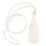 The Tiny Finch champagne bottle shaped gift tag in natural white paper with gold foil and matching ribbon
