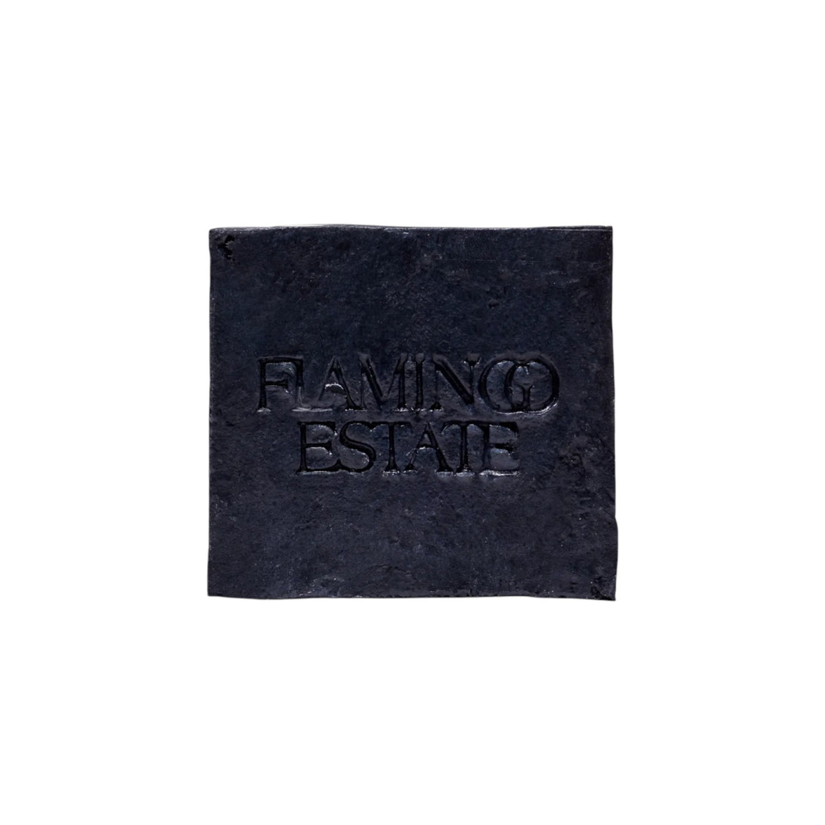 The Tiny Finch Flamingo Estate black activated charcoal and lavender soap brick with embossed logo
