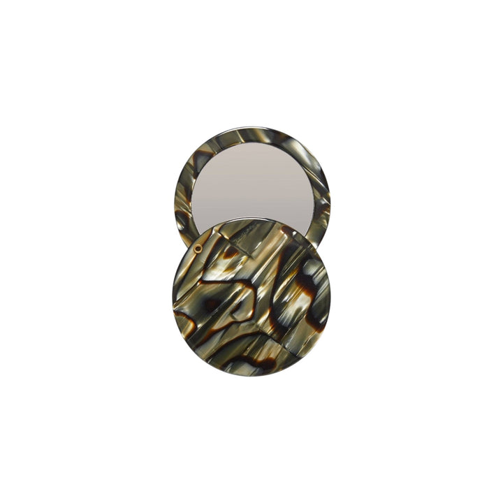 The Tiny Finch circle pocket mirror in midnight horn Italian acetate with a swivel opening mechanism.