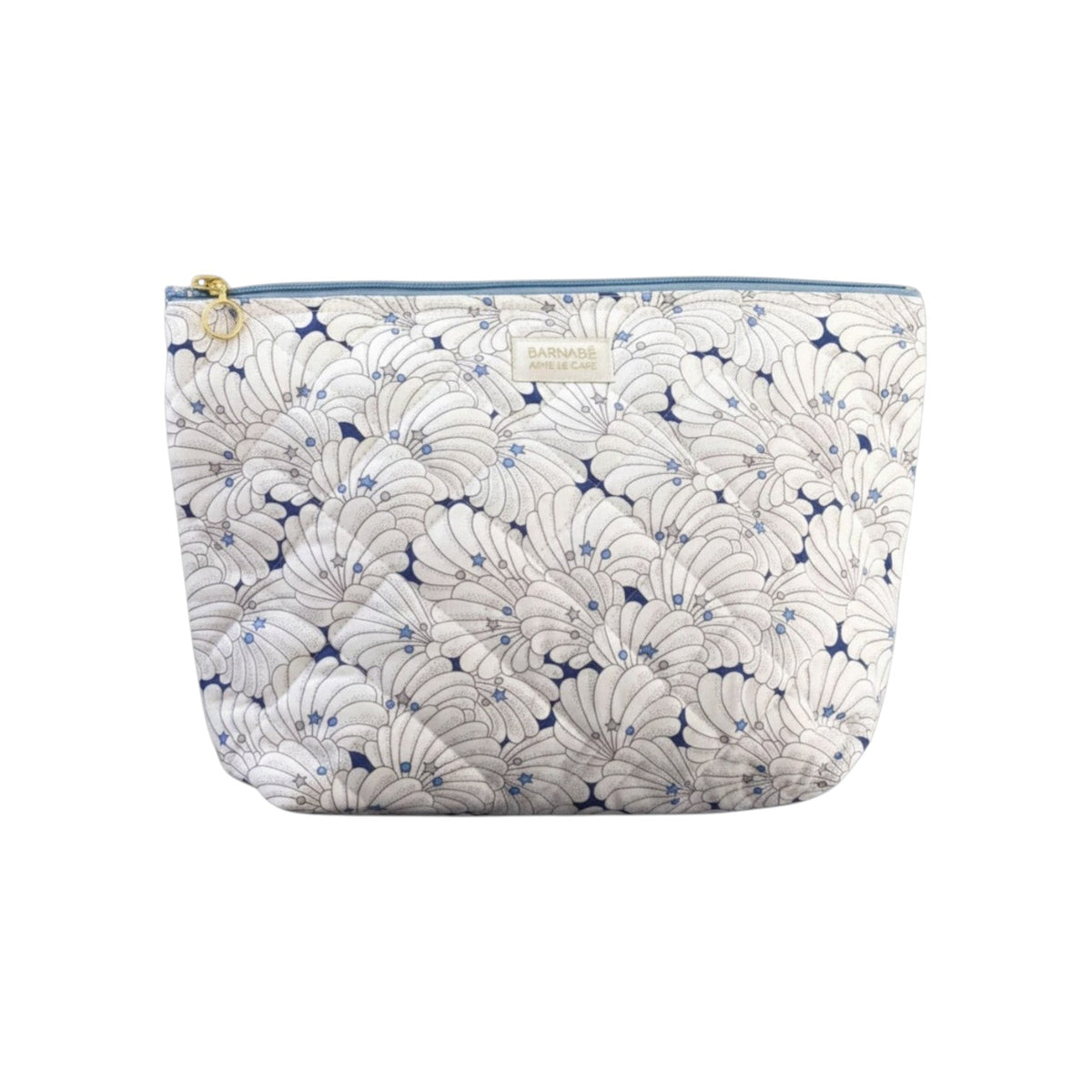 The Tiny Finch baby toiletry bag in Como Liberty fleece fabric with a quilted shell pattern and gold zipper detail.