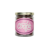 The Tiny Finch Coop's chocolate sprinkles in a 6 oz glass jar with a pink label featuring white cursive text.