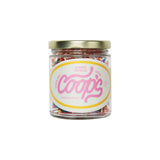 The Tiny Finch Coop's rainbow sprinkles in a 6 oz glass jar with a gold lid and natural plant-based colors.