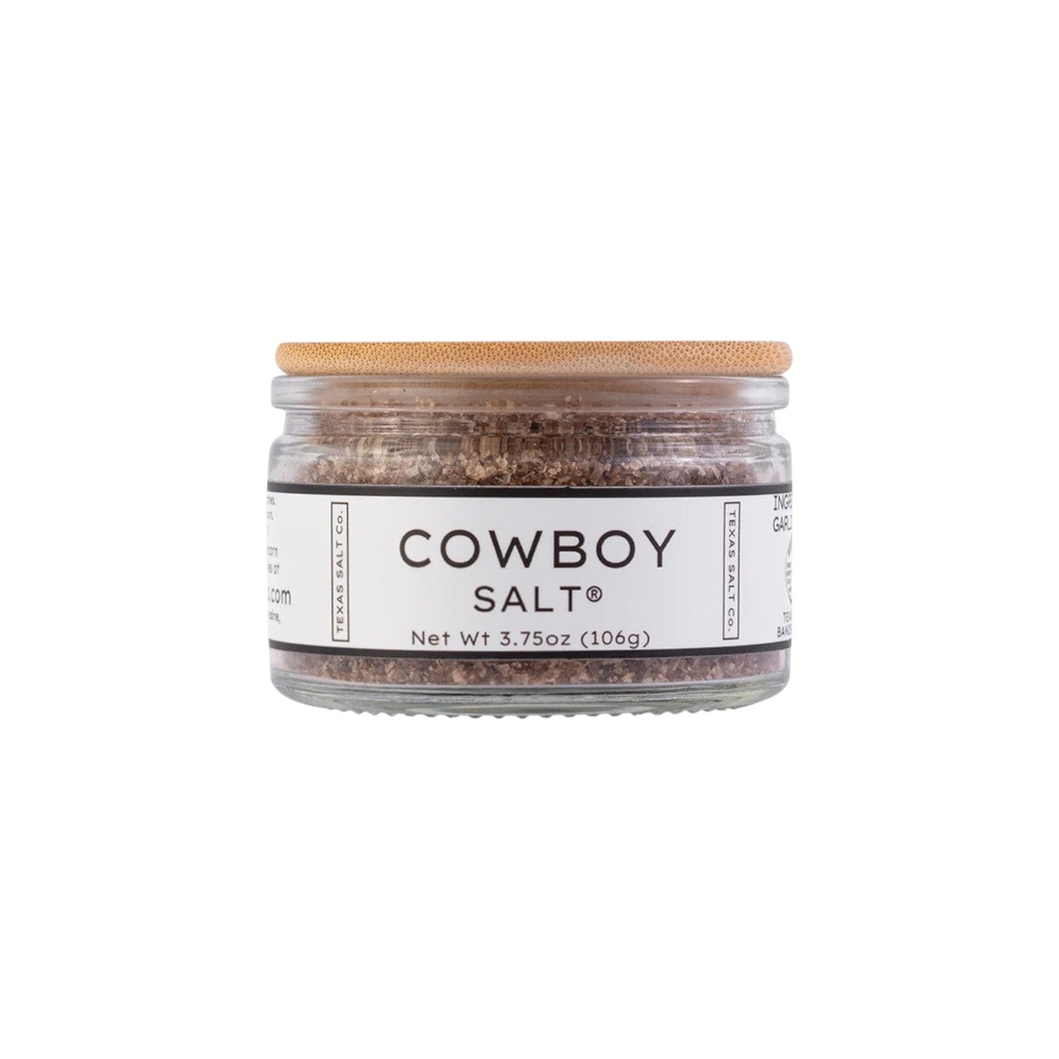 The Tiny Finch Texas Salt Co Cowboy Salt in a glass jar with a bamboo lid, featuring smoked sea salt with herbs.