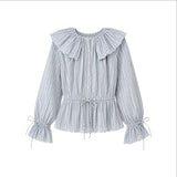 The Tiny Finch Delphi blouse in blue stripe cotton voile with ruffled collar, drawstring waist, and puffed sleeves.