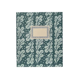 The Tiny Finch large hardback notebook in duck egg blue with a patterned oak leaf design and a central cream label.