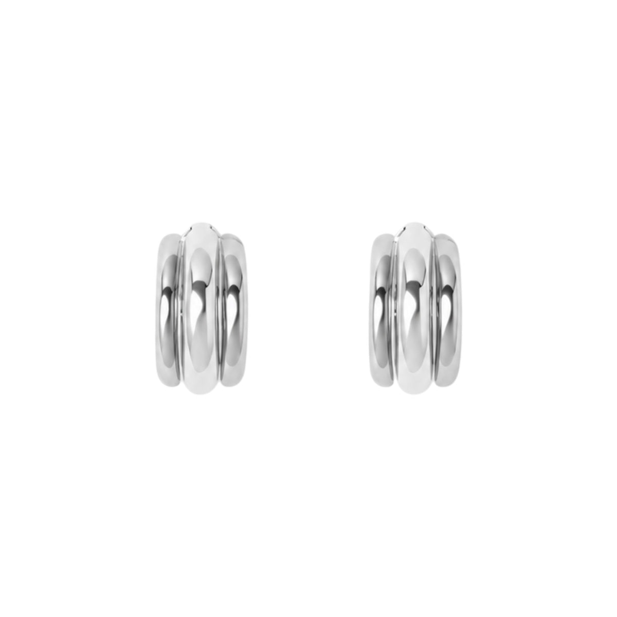 The Tiny Finch Elenora earrings in polished 925 sterling silver featuring a sculptural rounded hoop design.