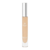 The Tiny Finch Macrene Actives high performance concealer in Extra Deep shade with a silver cap in a glass tube.
