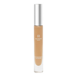 The Tiny Finch Macrene Actives high performance concealer in extra deep shade with a silver cap