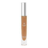 The Tiny Finch Macrene Actives high performance concealer in Extra Deep shade with a silver cap and clear tube.