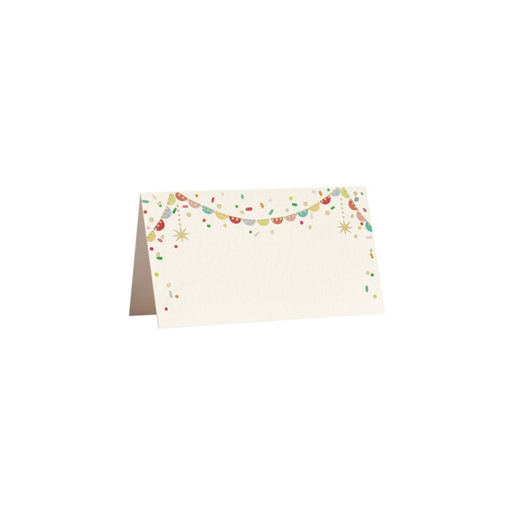 The Tiny Finch folded place card with natural white paper, colorful confetti illustration, and gold foil accents.