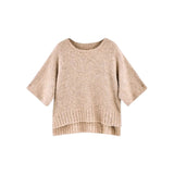 The Tiny Finch Fez Boucle top in graham cracker tan, featuring fuzzy alpaca knit, dolman sleeves, and a wide neckline.