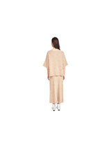 The Tiny Finch Fez Boucle oversized knit top in graham cracker alpaca blend with dolman sleeves, back view.