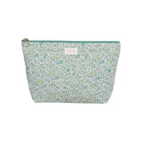 The Tiny Finch Andréa baby toiletry bag in floral Liberty cotton fleece with a green zipper and washable interior.
