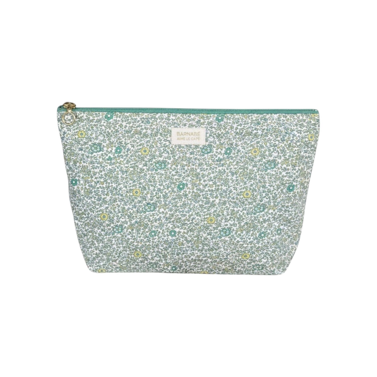 The Tiny Finch Andréa baby toiletry bag in floral Liberty cotton fleece with a green zipper and washable interior.