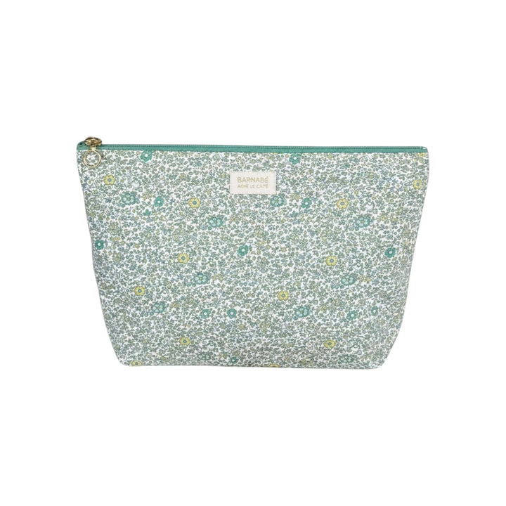 The Tiny Finch Andréa baby toiletry bag in floral Liberty cotton fleece with a green zipper and washable interior.