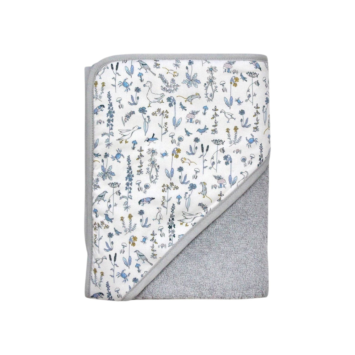 The Tiny Finch Baby Towel Gus featuring a white Liberty floral print and soft grey sponge loop fabric.