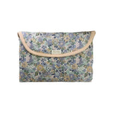 The Tiny Finch Jenny baby changing mat in floral Liberty fleece fabric, folded into a compact pouch with snap closure.