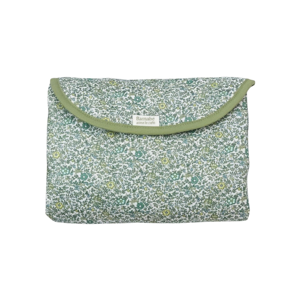 The Tiny Finch Andréa travel changing mat in green Liberty floral cotton print, folded into a compact pouch.