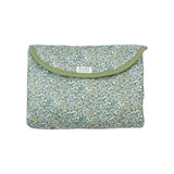 The Tiny Finch Andréa travel changing mat in green Liberty floral cotton print, folded into a compact pouch.