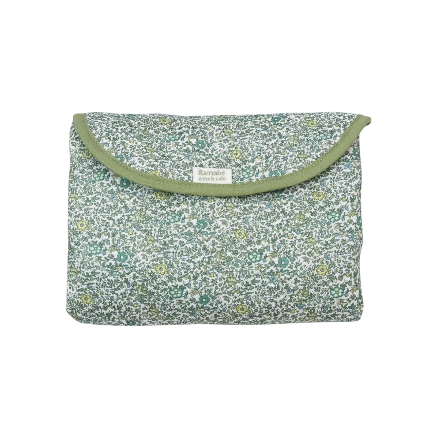 The Tiny Finch Andréa travel changing mat in green Liberty floral cotton print, folded into a compact pouch.