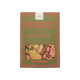 The Tiny Finch East End Press Garland Banquet in green packaging with screen-printed paper pie and cake shapes.