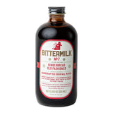 The Tiny Finch Bittermilk No. 7 Gingerbread Old Fashioned cocktail mixer in a glass bottle with a festive label.
