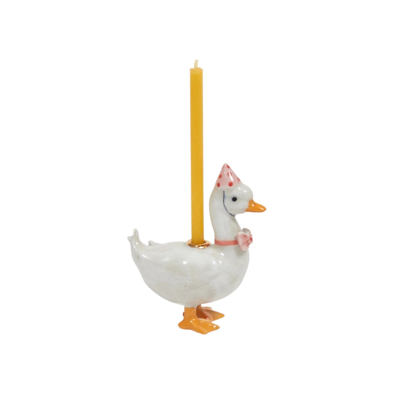The Tiny Finch ceramic goose cake topper wearing a pink polka dot party hat and bowtie with a yellow candle