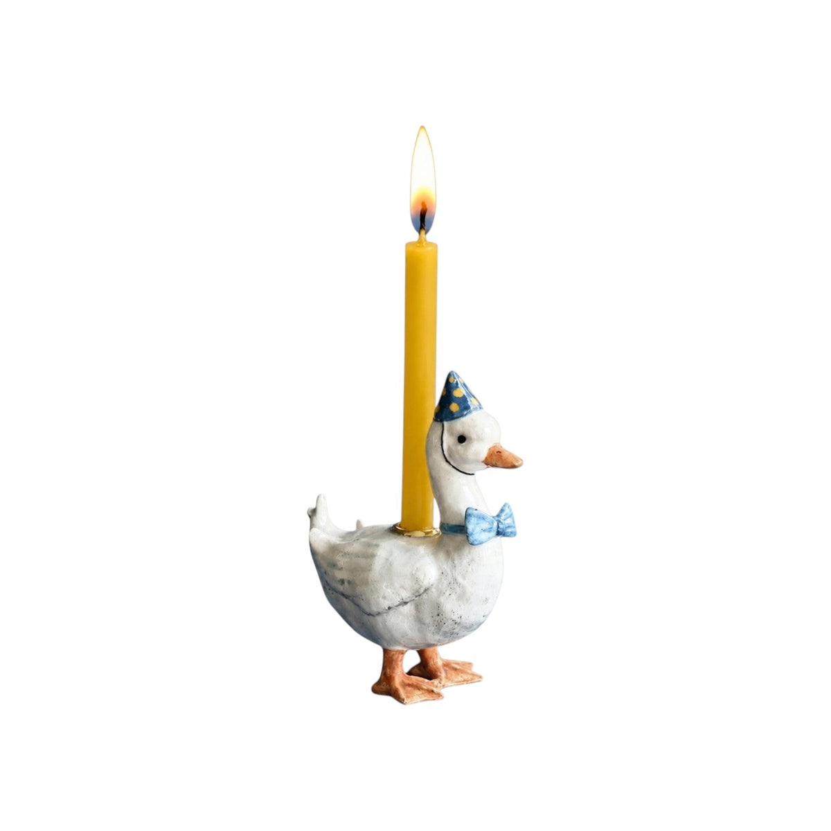 The Tiny Finch goose cake topper wearing a blue party hat and bow tie with a lit yellow birthday candle