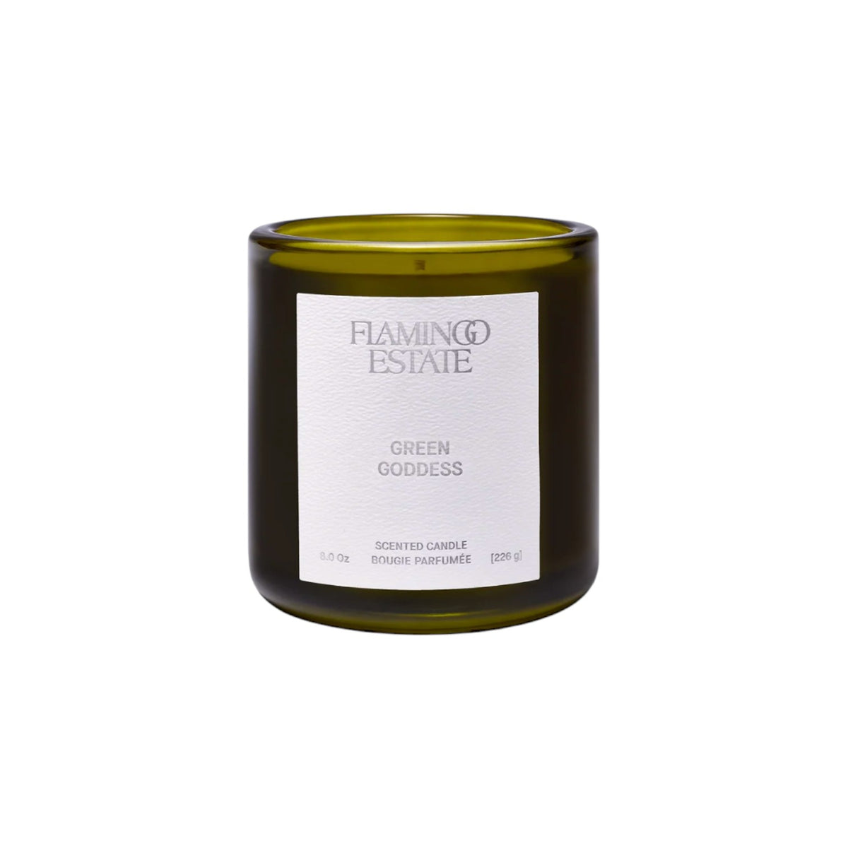 The Tiny Finch Green Goddess scented candle in a dark green glass jar with a white label