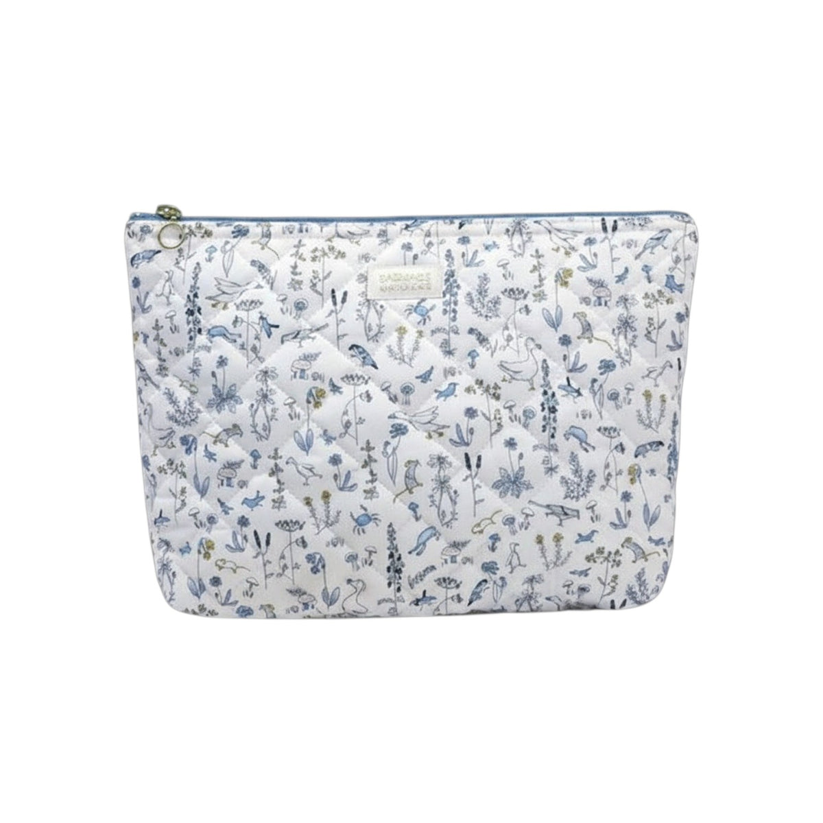 The Tiny Finch Gus baby toiletry bag in quilted Liberty fleece with a floral bird print and washable interior.