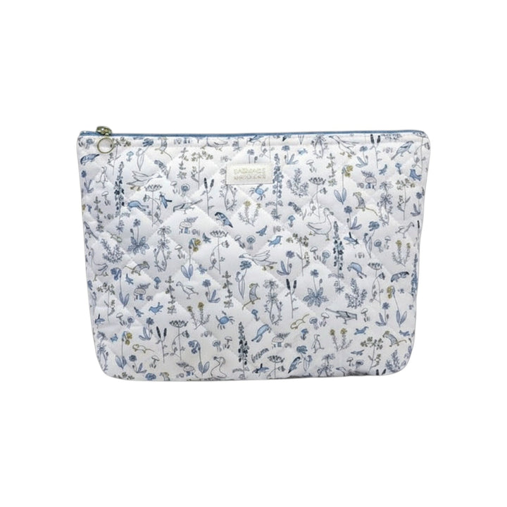 The Tiny Finch Gus baby toiletry bag in quilted Liberty fleece with a floral bird print and washable interior.