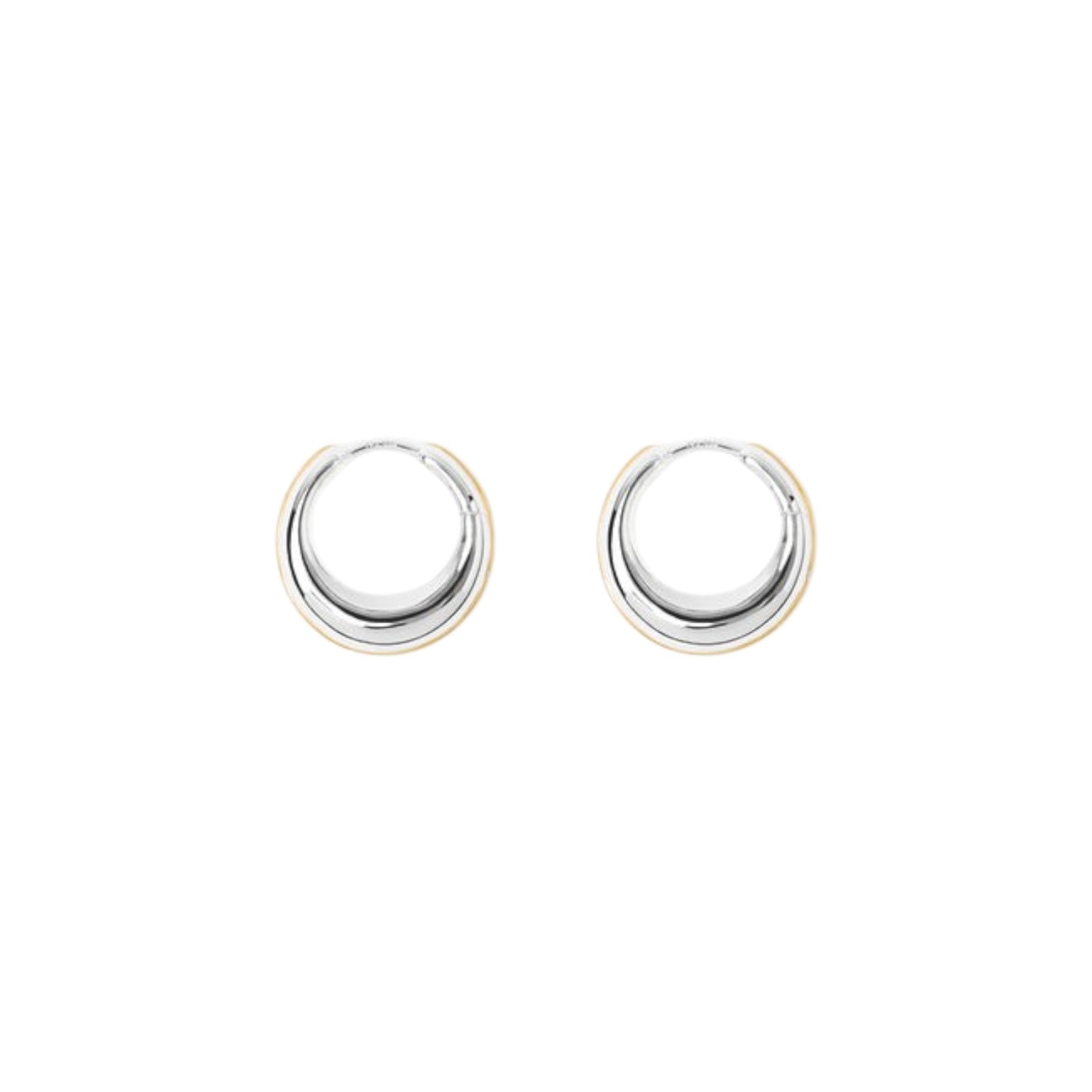 The Tiny Finch Harper earrings featuring a rounded, sculptural hoop design in polished sterling silver and gold plate.