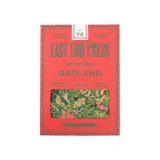 The Tiny Finch East End Press holly and ivy Christmas garland in red and green recycled paper packaging