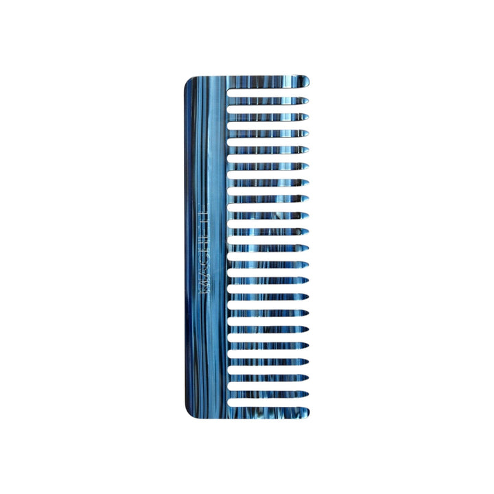 The Tiny Finch wide-tooth hair comb in indigo blue handcrafted Italian acetate with a marbled finish