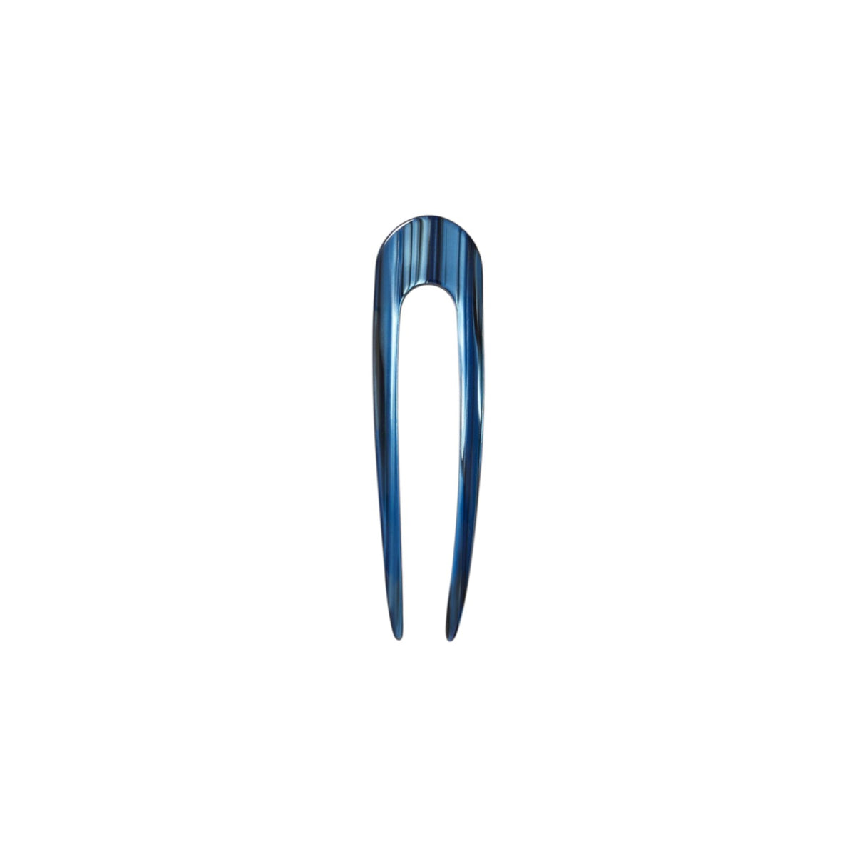 The Tiny Finch French hair pin in indigo blue, handcrafted from polished Italian acetate with a sleek U-shape design.