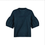 The Tiny Finch Intention Top in indigo featuring a relaxed fit, crew neckline, and gathered puff sleeves.