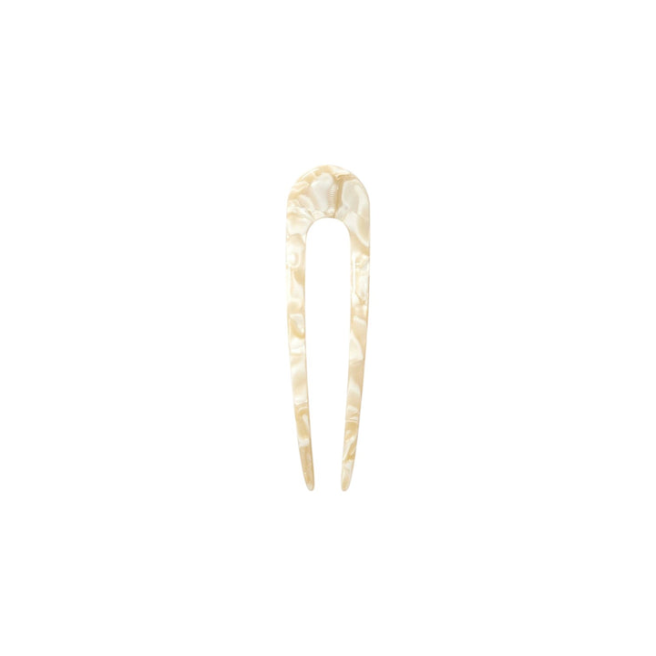 The Tiny Finch ivory French hair pin handcrafted from polished Italian acetate with a classic U-shaped design.
